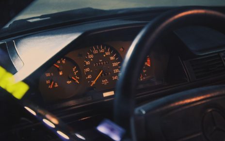 close-up view of a car dashboard with speed and fuel gauges